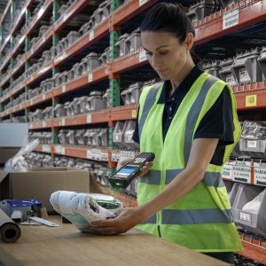 warehouse worker with a zebra device